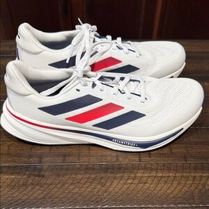 Adidas women’s supernova rise White Running Shoes with Navy & Red Accents